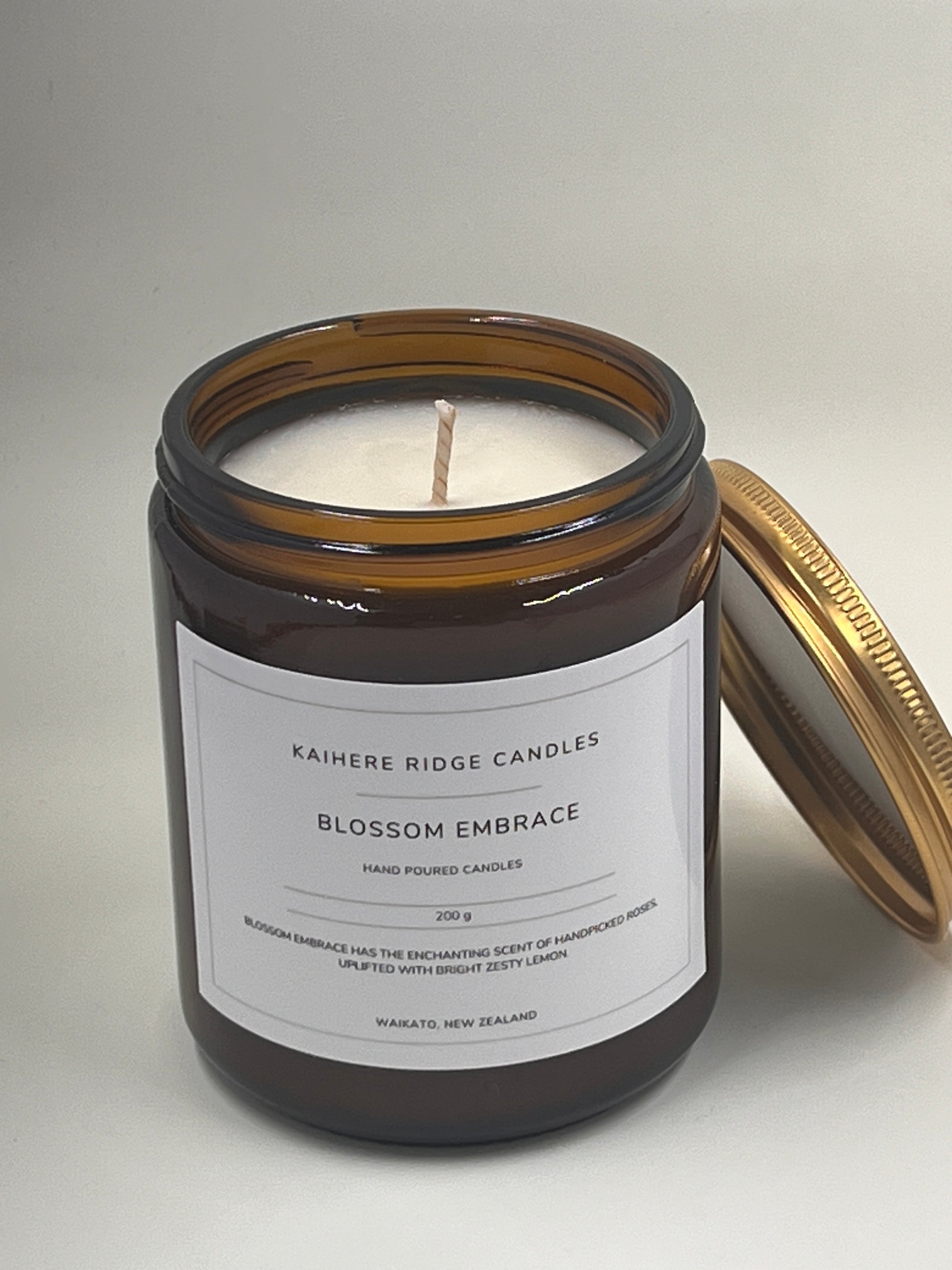 Amber jar candles with Blossom Embrace label - natural soy wax, floral fragrance, made in NZ